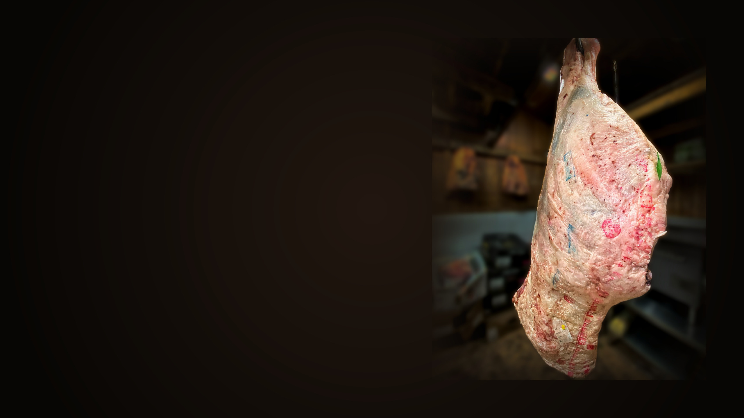A whole primal aging on the bone in the Babylon Village Meat Market aging room