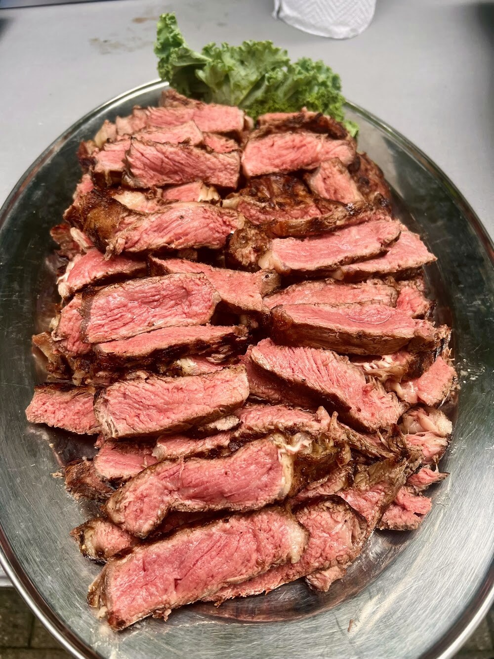 A dry-aged steak, sliced to show the grain