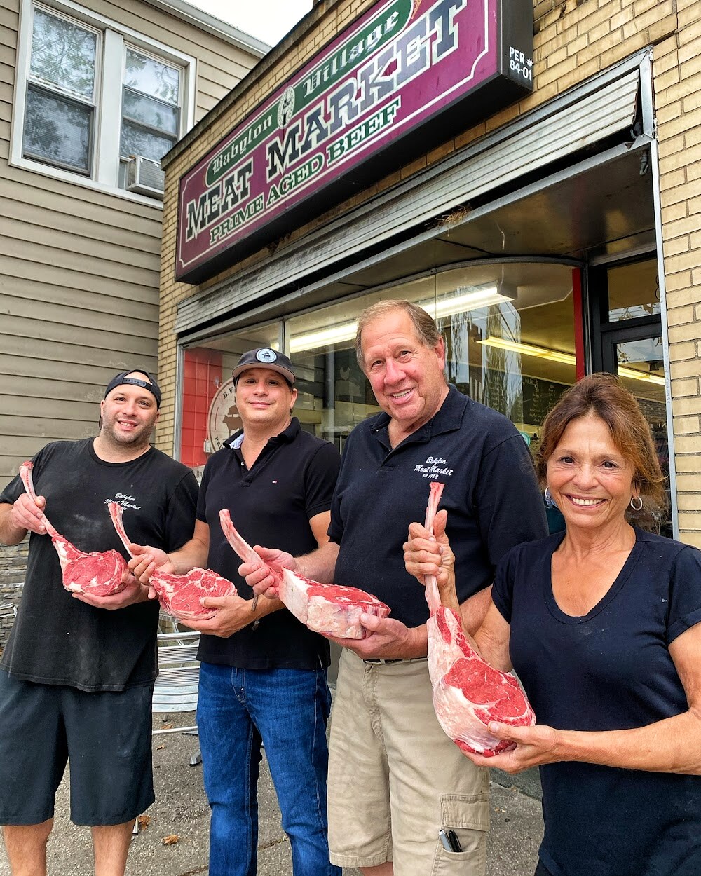 The family outside Babylon Village Meat Market