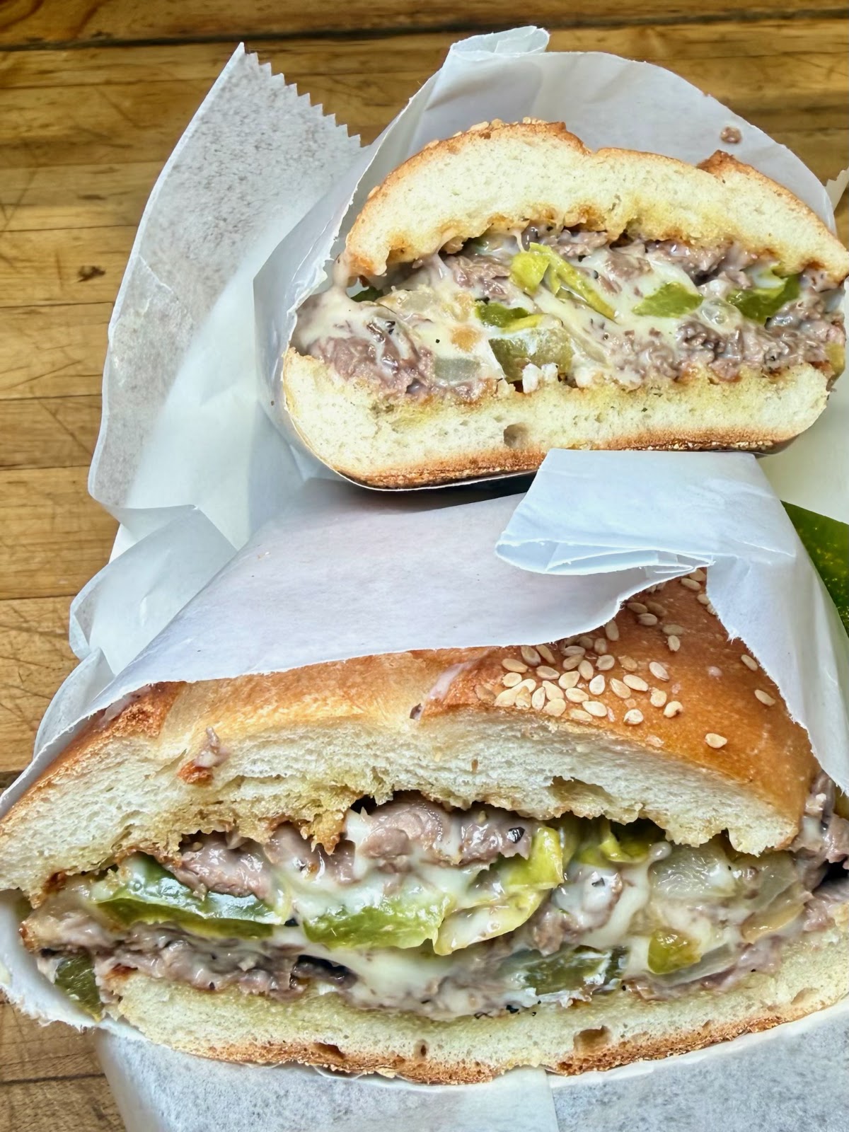 A Philly cheesesteak on a seeded roll
