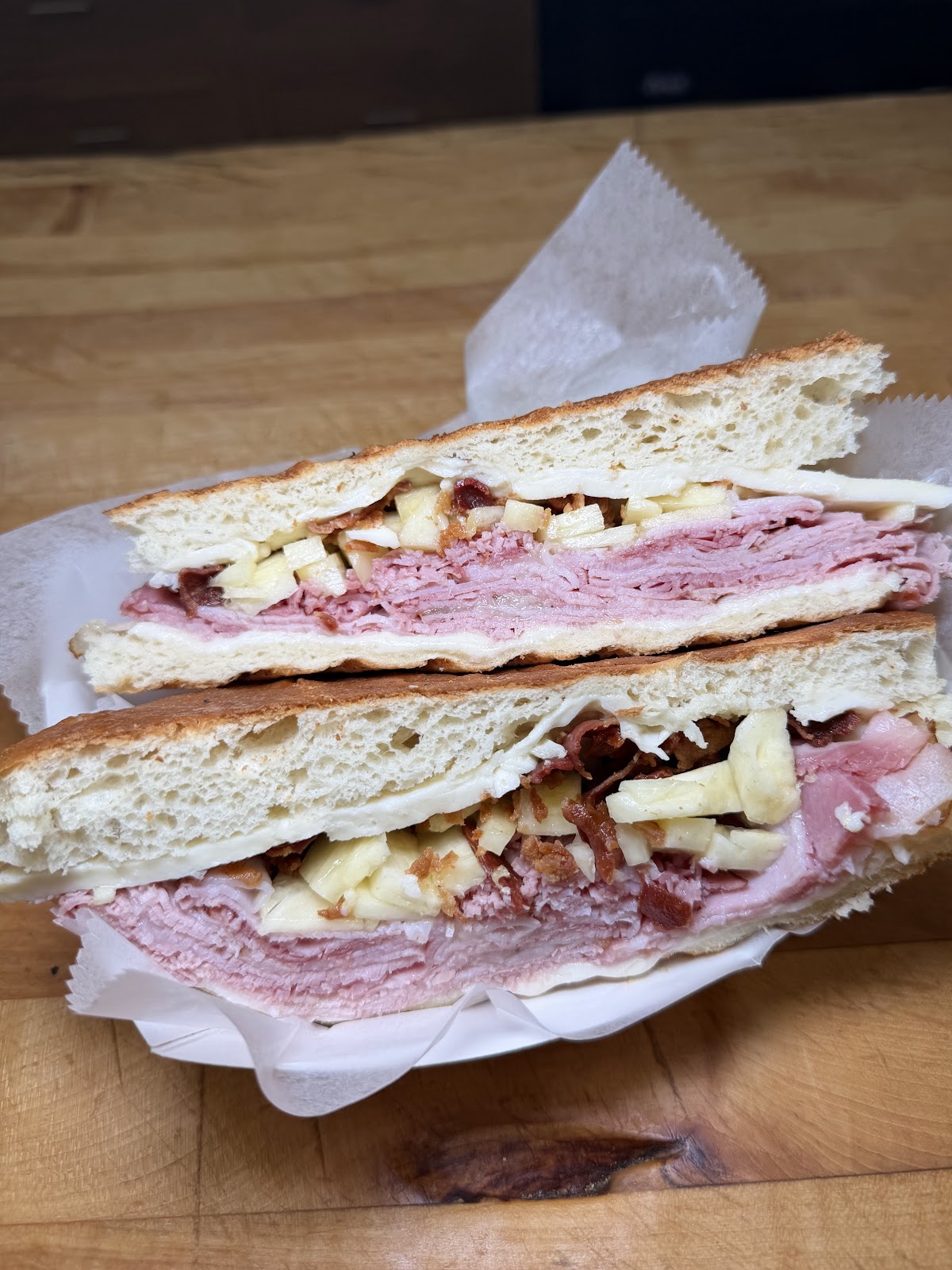 A roast beef club, cut and stacked