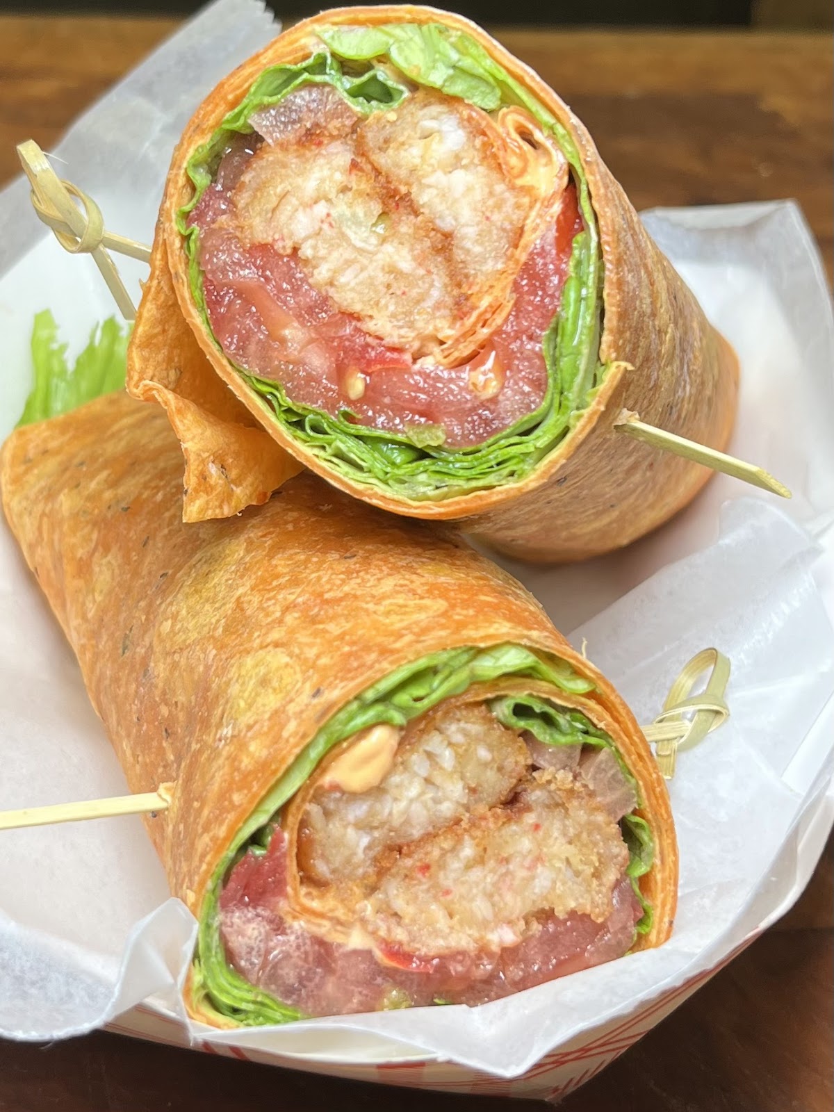 A crabcake wrap, cut to show the filling