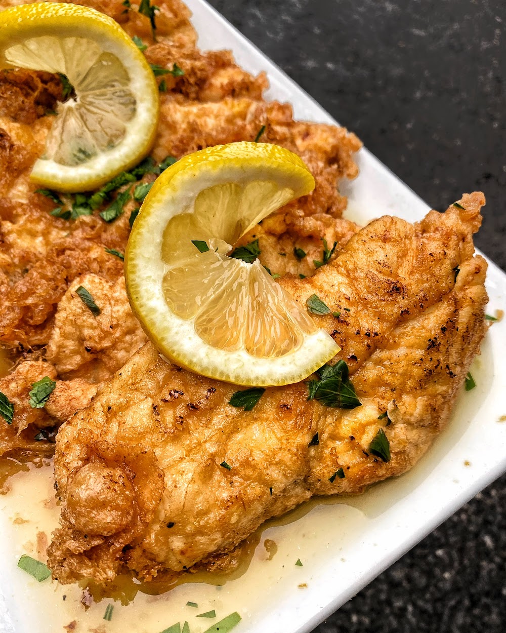 A golden fried chicken cutlet