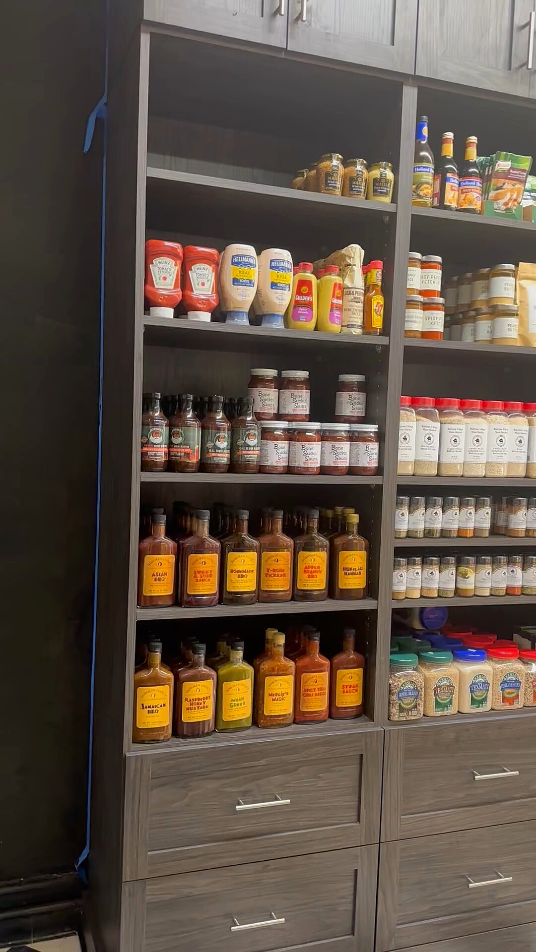 A wall of sauces, rubs and seasonings at the Market